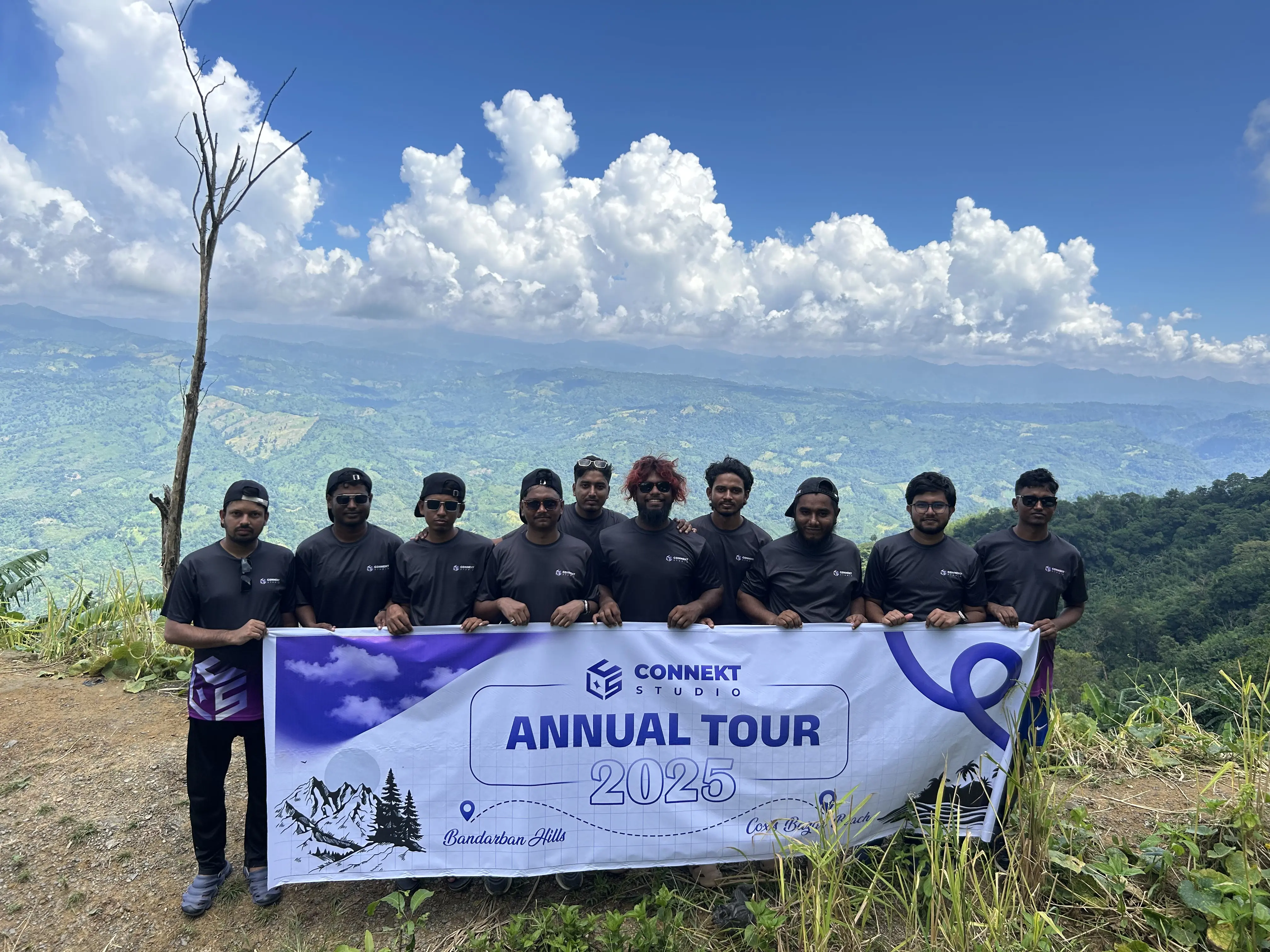 ConnektStudio team members creating banner content in Bandarban's scenic locations