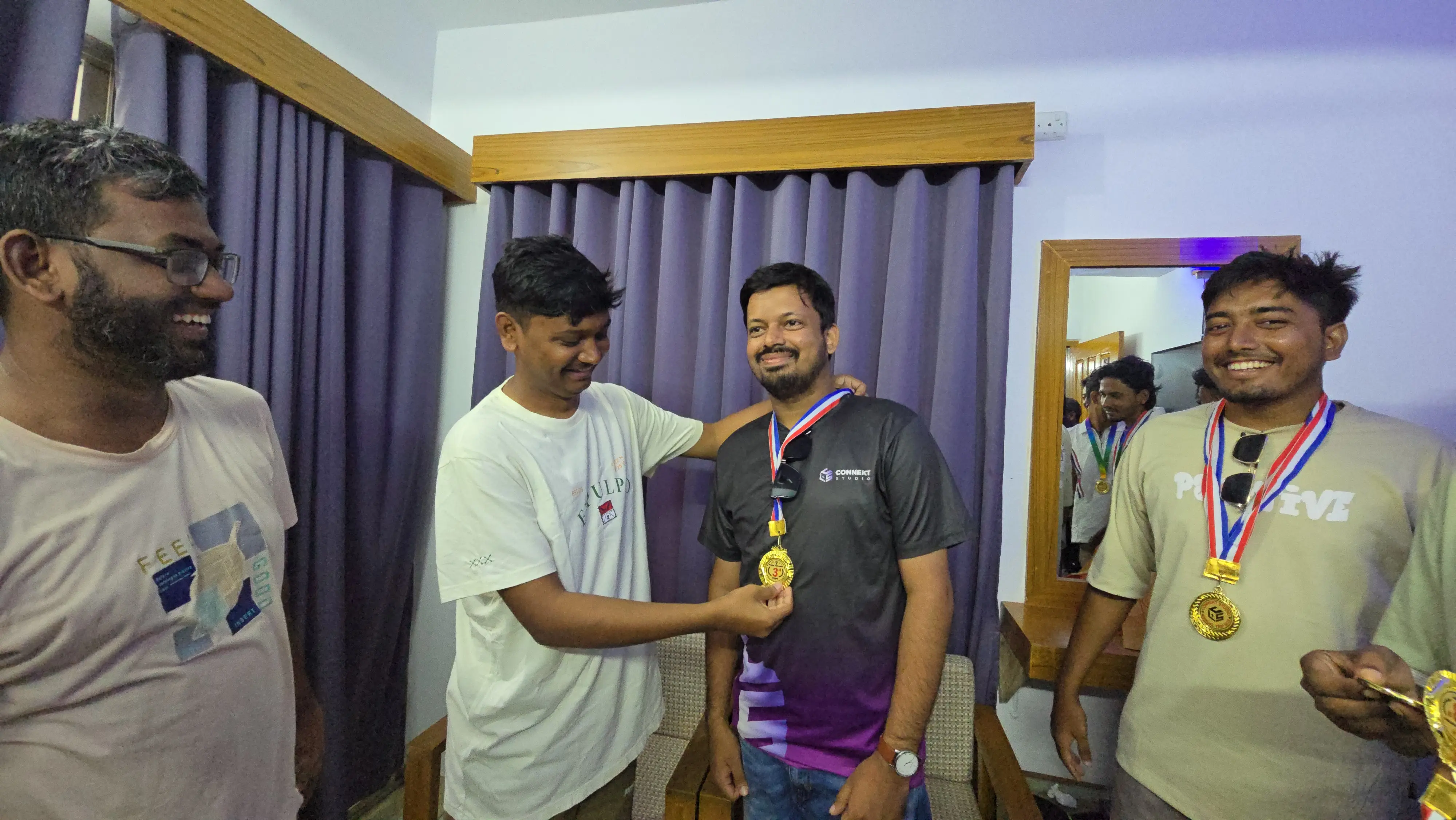 Nayem proudly showing his medal after winning beach games