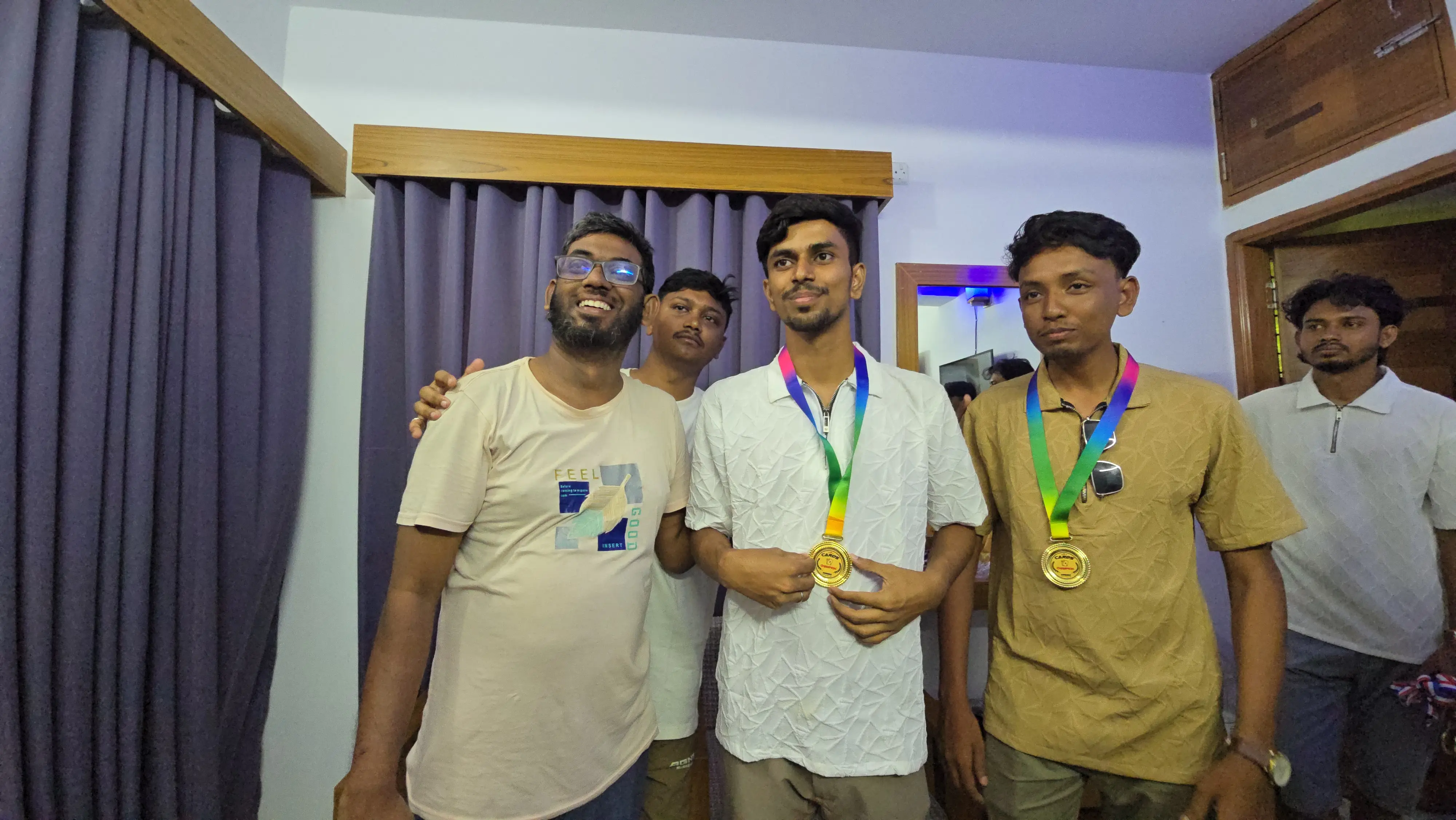 Kayes and Mahmudul proudly displaying their game medals after winning competition