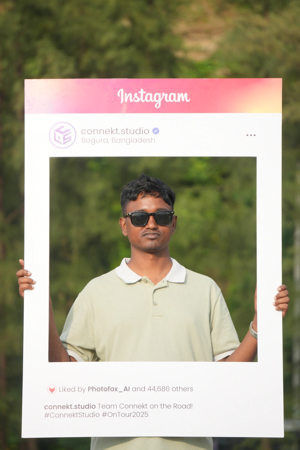 Nasir creating content for PhotoFox banner at the beach