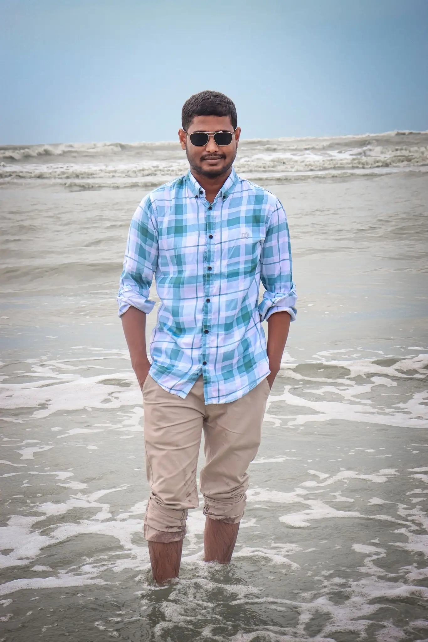 Akram playing in the waves during our team retreat at Cox's Bazar