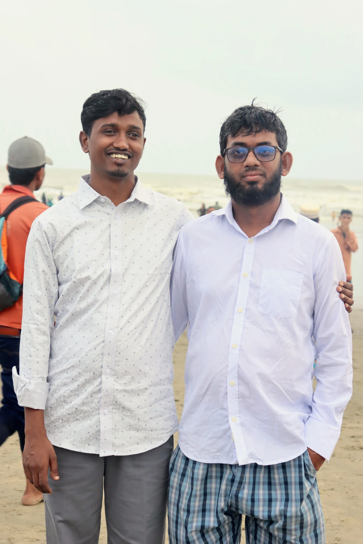 Nasir and Saiful sharing a cheerful moment at Cox's Bazar beach