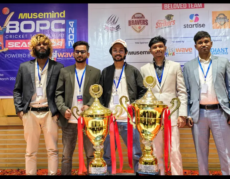Team members enjoying a cricket match during company event