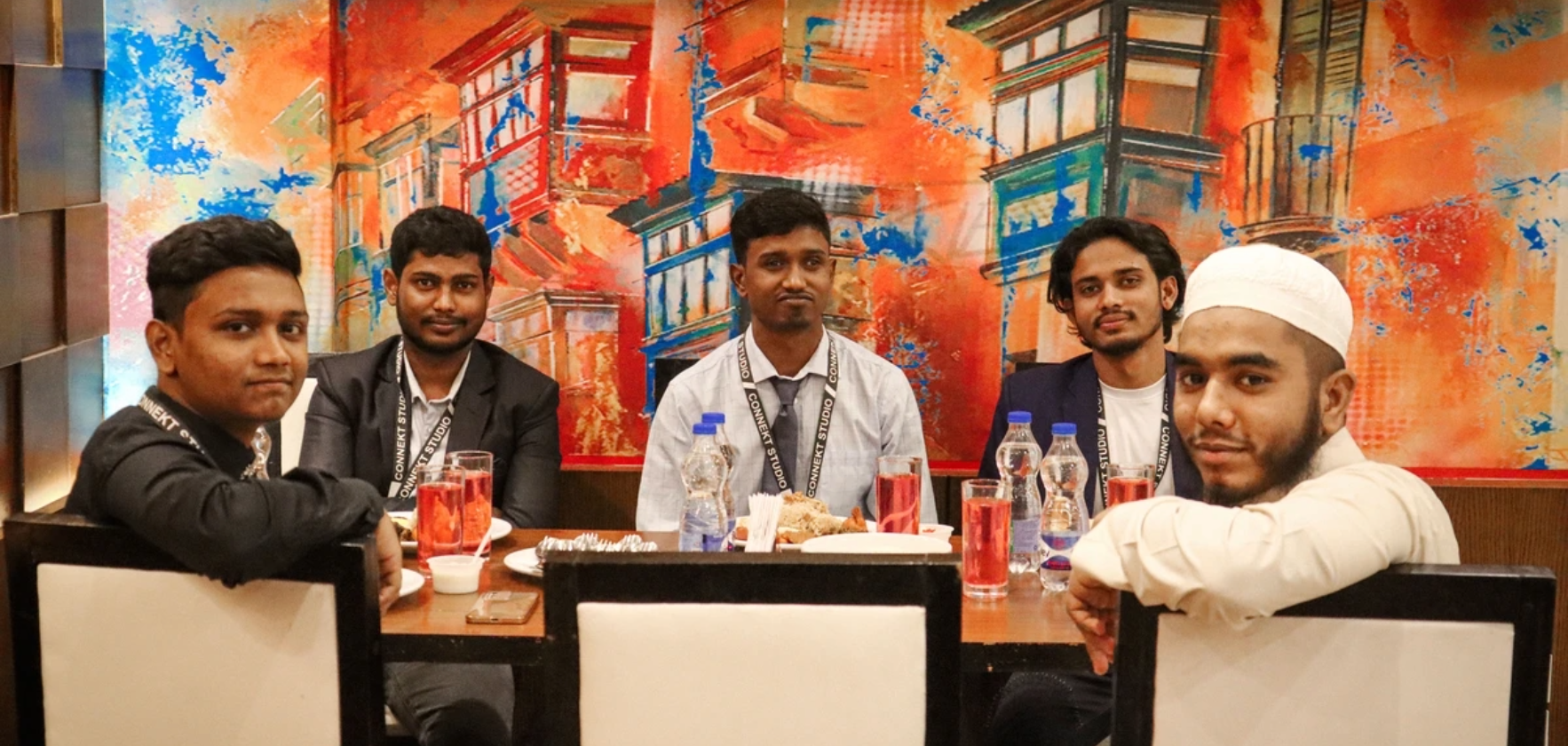 Team members sharing joyful moments at Iftar gathering 2022