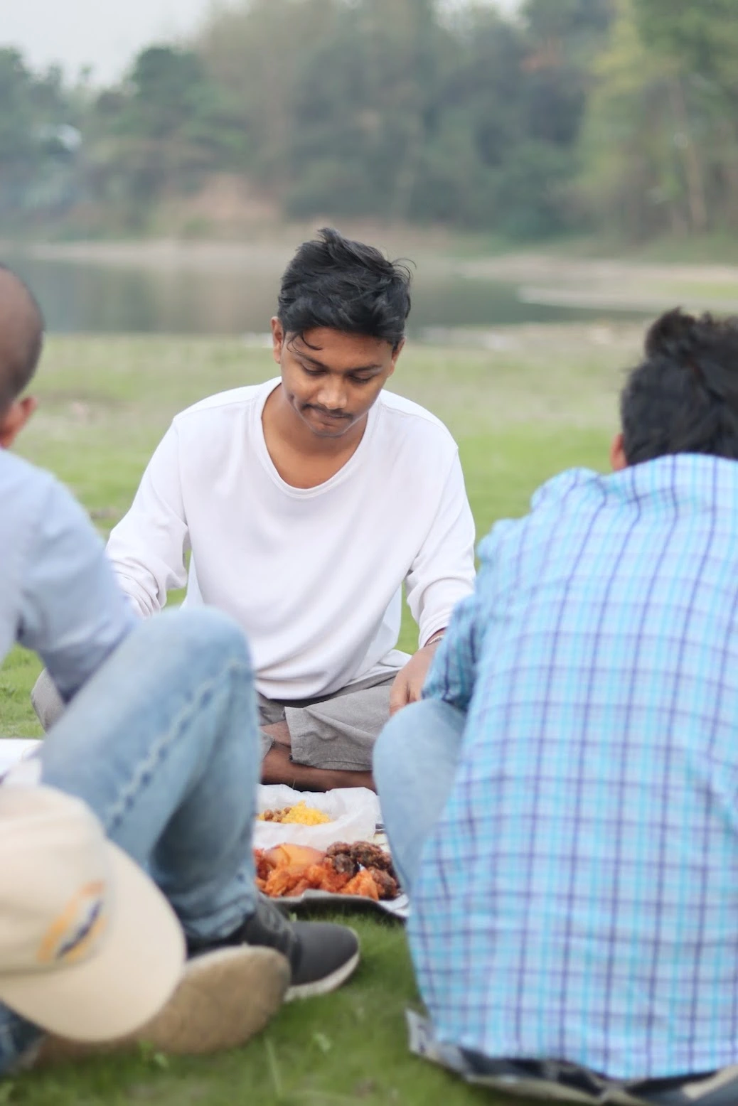 Nasim preparing for Iftar with team members, arranging traditional Ramadan delicacies 2023
