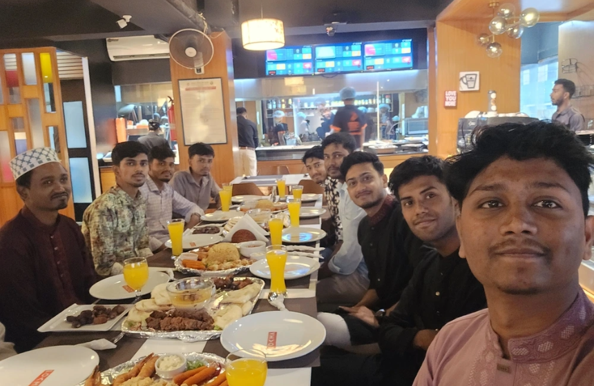 Team members breaking fast together during Ramadan celebration