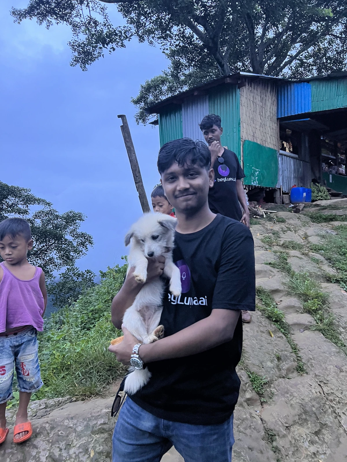 Nasim making friends with a local dog during the Rangamati trip