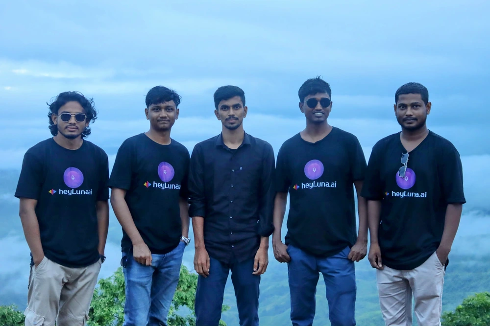 Team group photo with the stunning Sajek Valley backdrop