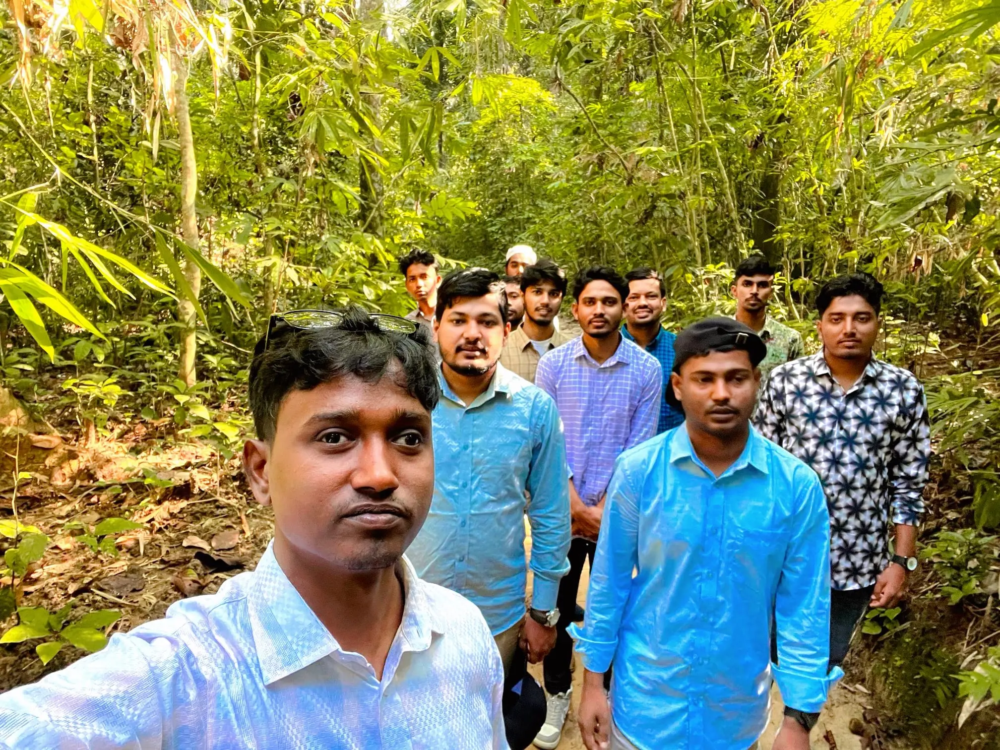 Team group photo at Lawachara National Park's lush forest