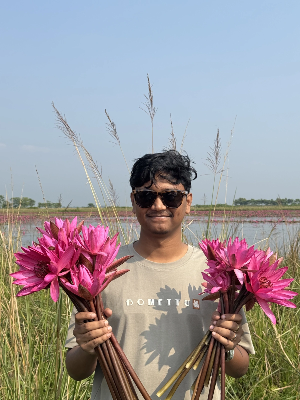 Nasim exploring the scenic lotus pond in Sylhet