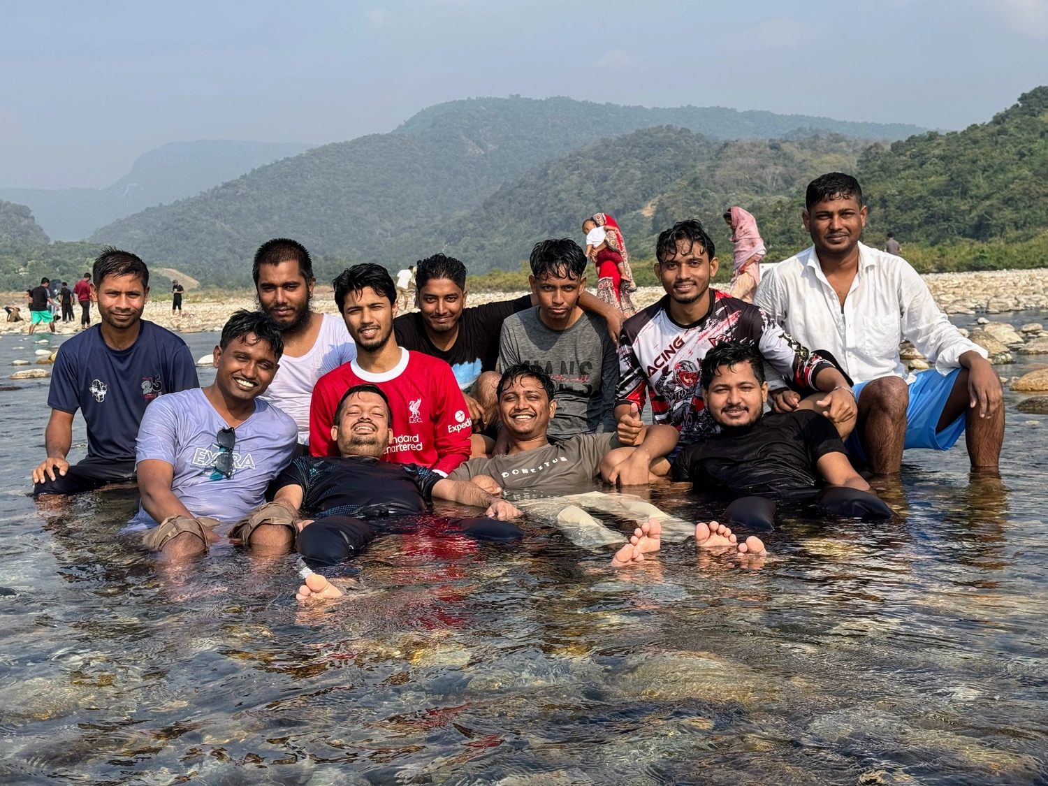 Team members enjoying the scenic viewpoint at Sada Pathor