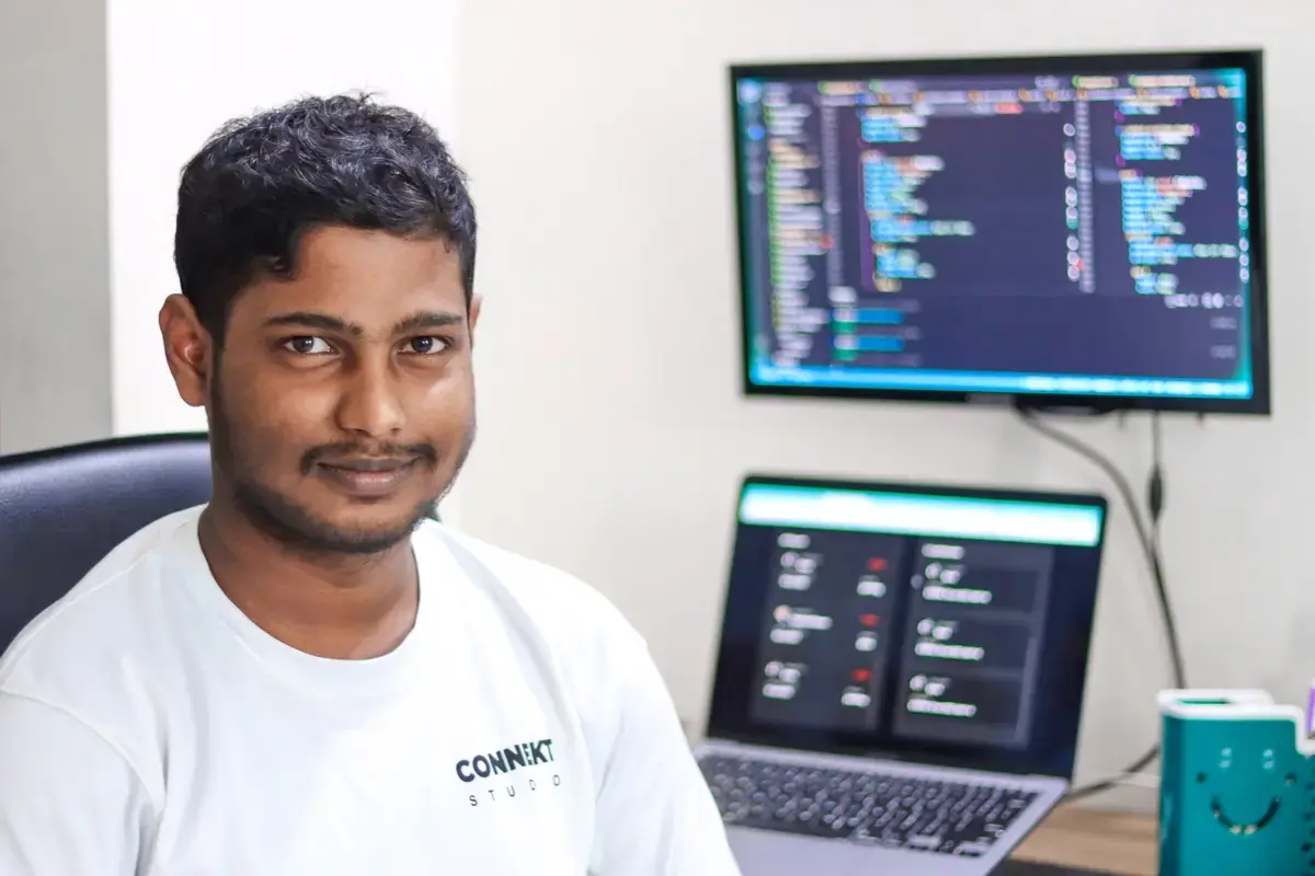 Akram focused on development at his workstation